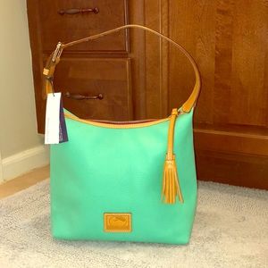 Dooney&Bourke mint green pebbles leather purse.
